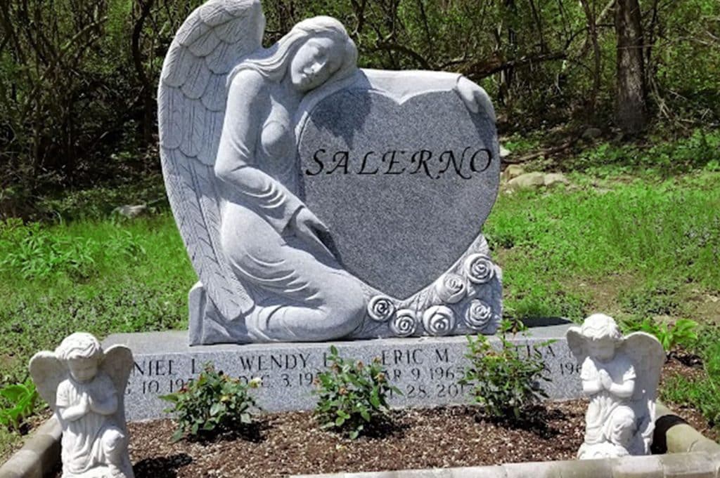 angel hugging heart monument Clifford grave marker slant headstone grave stone cemetery marker St. Michael cemetery