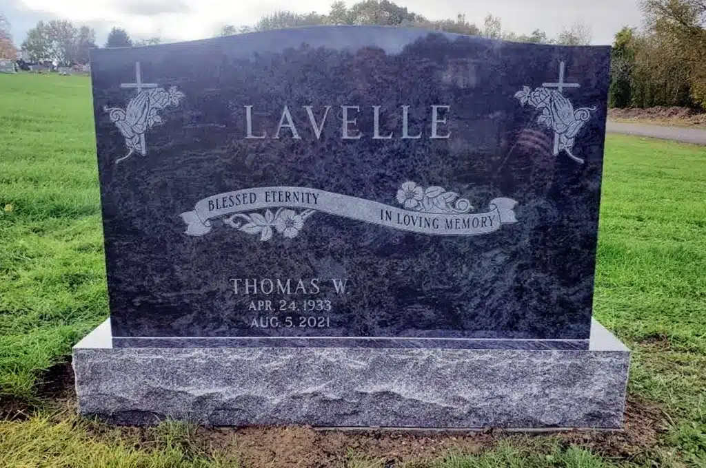 Upright Monument Bahama Blue Granite Praying Hands with Cross Engraving Ribbon Engraving Blessed Eternity In Loving Memory